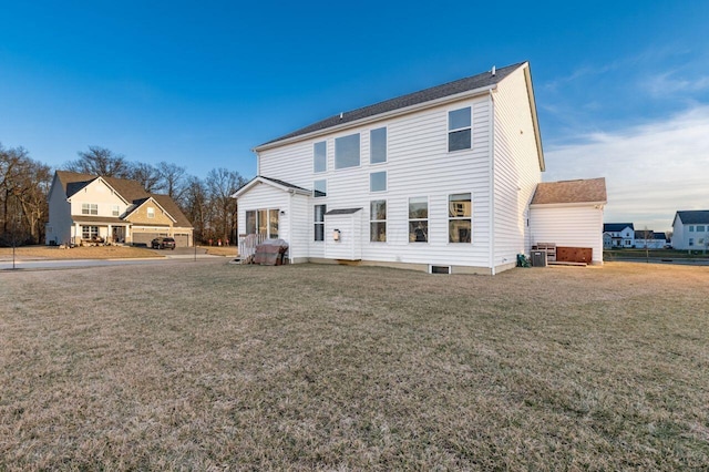 back of property featuring a lawn