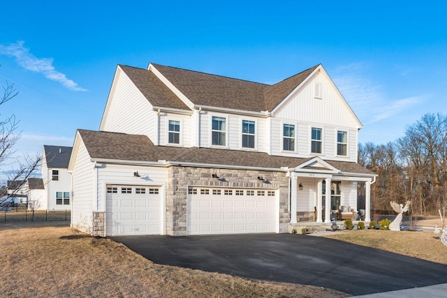 view of front of house featuring a garage and a front yard