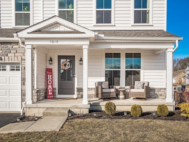 property entrance with a porch and a garage