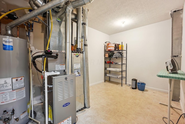 utility room featuring water heater