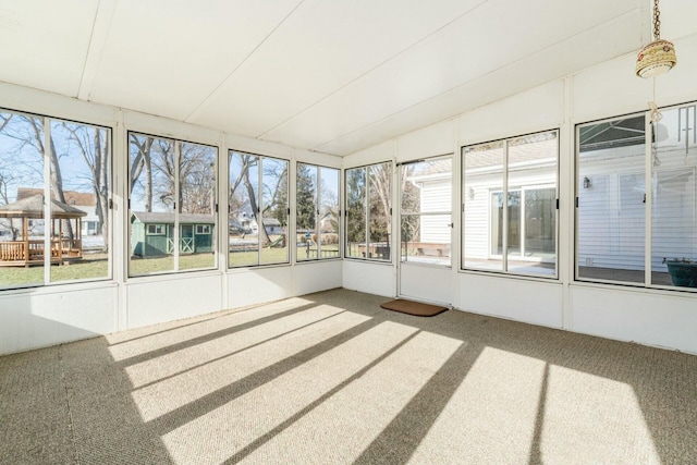 unfurnished sunroom with a wealth of natural light