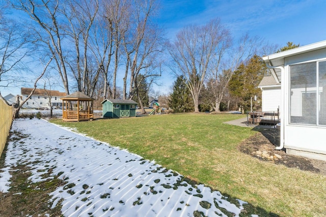 view of yard with a gazebo and a shed