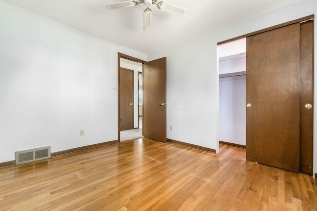 unfurnished bedroom featuring ceiling fan and light wood-type flooring