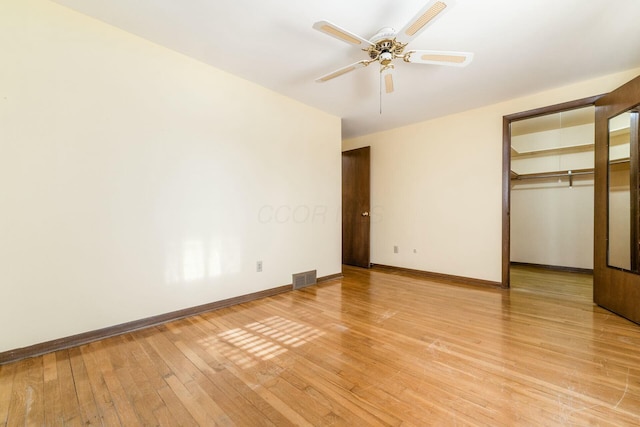 unfurnished bedroom with a closet, ceiling fan, and light hardwood / wood-style floors