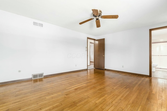 empty room with ceiling fan and light wood-type flooring