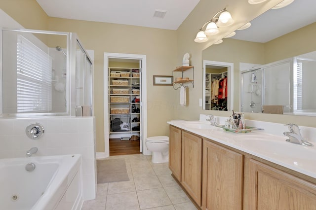 full bathroom with separate shower and tub, tile patterned flooring, vanity, and toilet