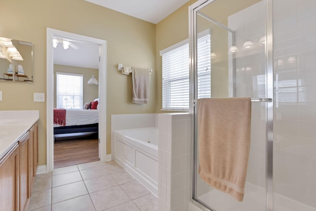 bathroom with separate shower and tub, tile patterned floors, and a healthy amount of sunlight