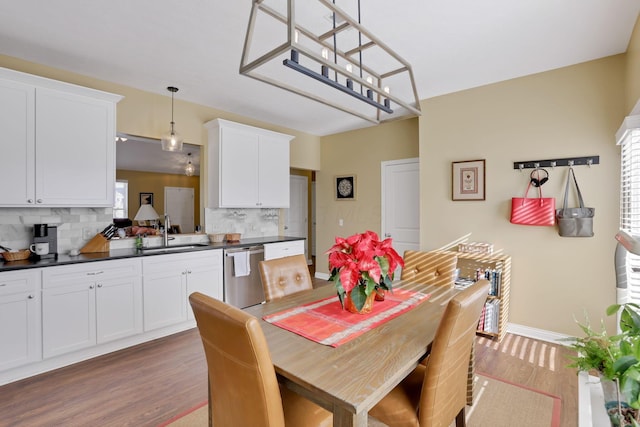 dining room featuring light hardwood / wood-style floors and sink