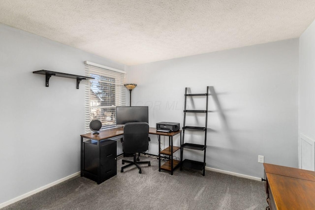 office area featuring a textured ceiling and dark carpet