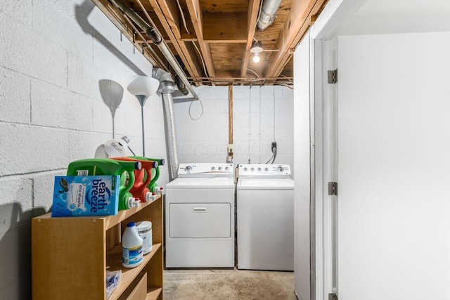 clothes washing area with washer and clothes dryer