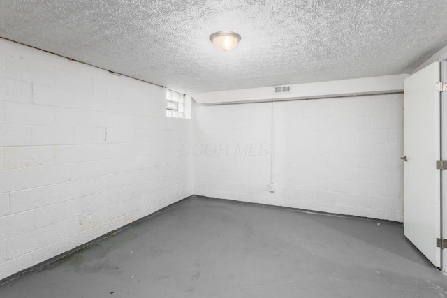 basement with a textured ceiling