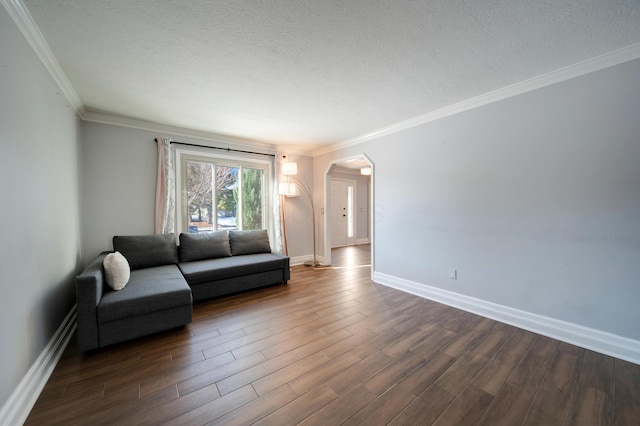 unfurnished living room featuring ornamental molding, dark hardwood / wood-style flooring, and a textured ceiling