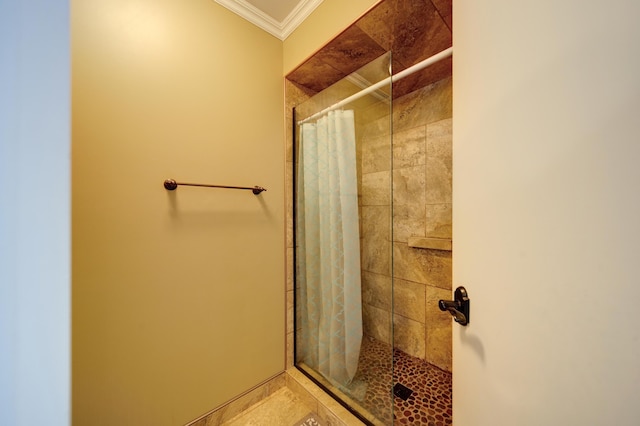 bathroom featuring ornamental molding and a shower with shower curtain