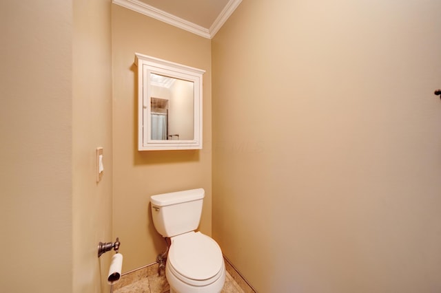 bathroom with crown molding and toilet