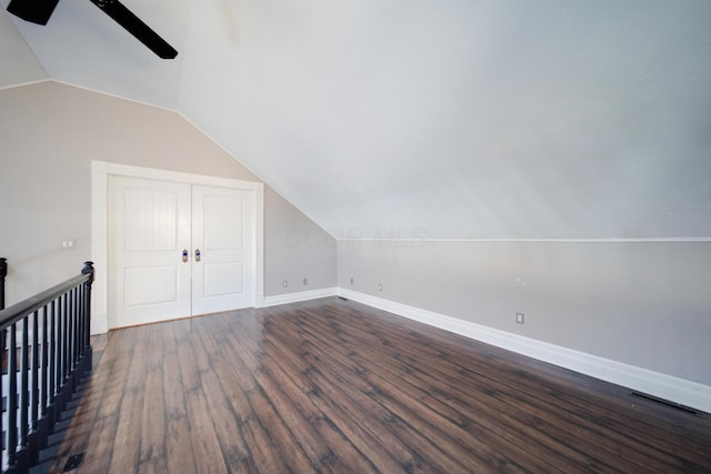 additional living space featuring lofted ceiling, dark wood-type flooring, and ceiling fan