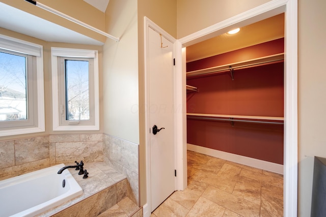 bathroom with tiled tub