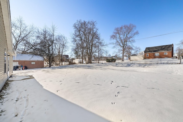 view of yard covered in snow