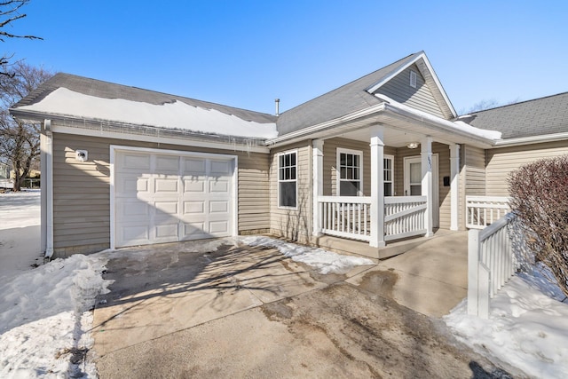 view of front of house featuring a garage and covered porch