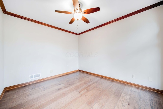 unfurnished room featuring ceiling fan, ornamental molding, and light hardwood / wood-style flooring