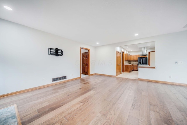 unfurnished living room with light hardwood / wood-style floors