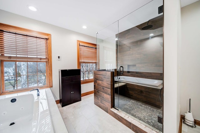 bathroom featuring separate shower and tub and a wealth of natural light