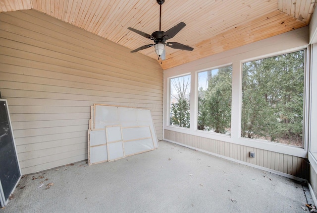 unfurnished sunroom with vaulted ceiling, ceiling fan, and wood ceiling