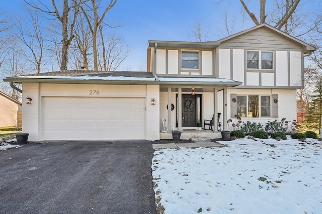 view of front facade with a garage and covered porch