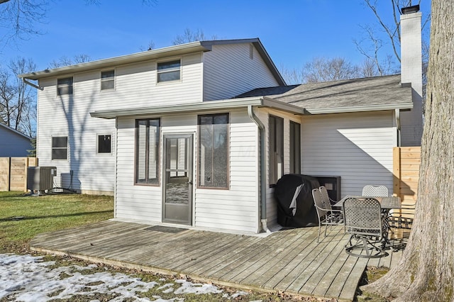 back of house with central AC and a deck