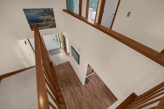 stairs with hardwood / wood-style floors