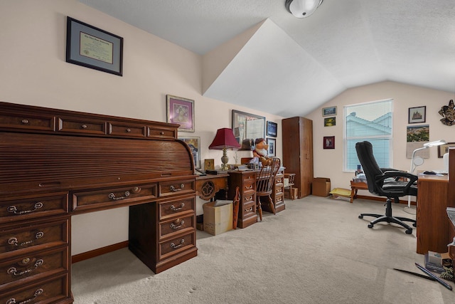 carpeted office space with lofted ceiling