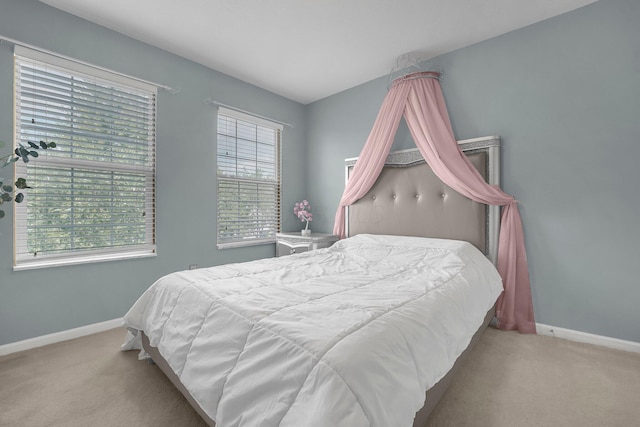 bedroom with light carpet