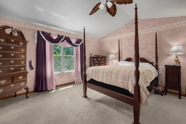 carpeted bedroom featuring ceiling fan and vaulted ceiling