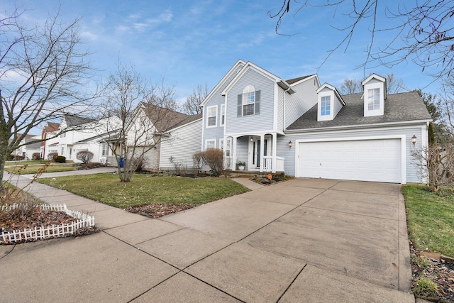 view of front of home with a garage and a front yard