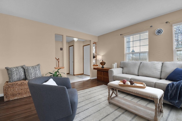 living room featuring hardwood / wood-style flooring and a textured ceiling