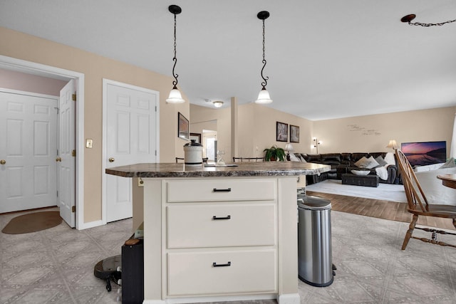 kitchen with white cabinetry, pendant lighting, and a center island