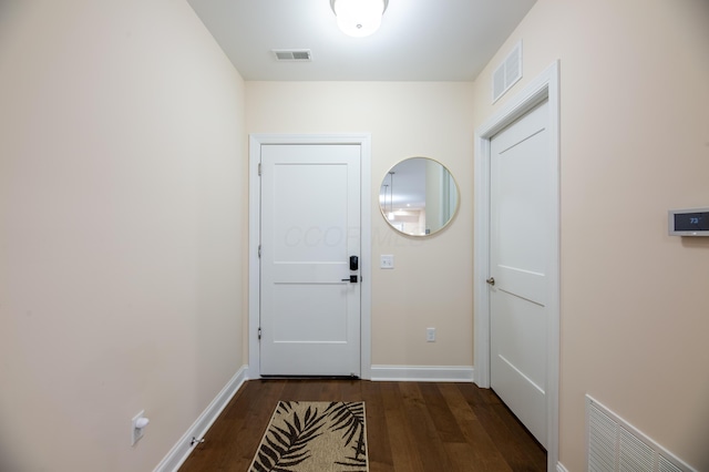 doorway with dark hardwood / wood-style floors