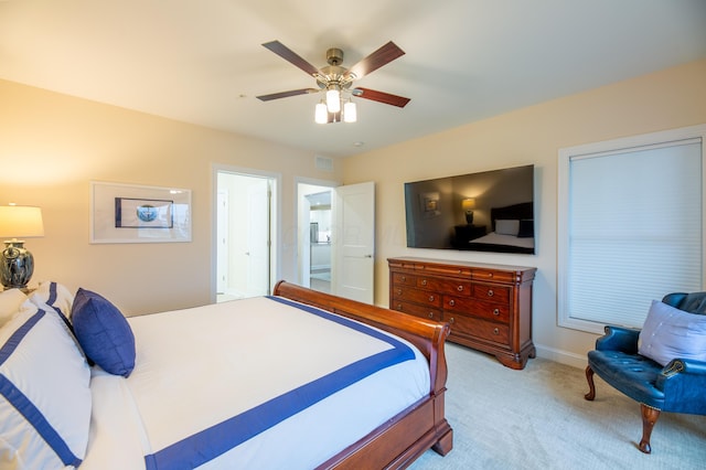 bedroom featuring light colored carpet and ceiling fan