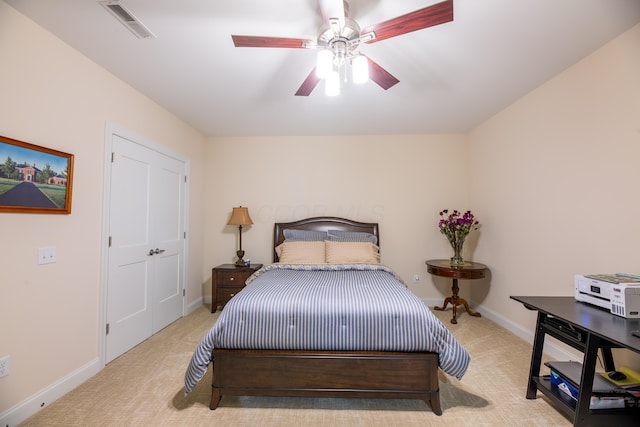 carpeted bedroom with ceiling fan