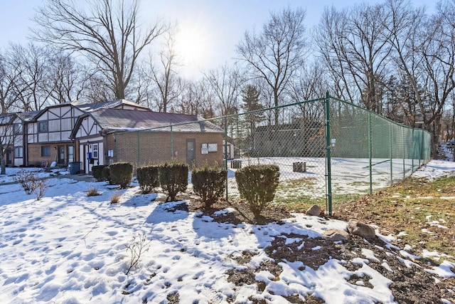 view of yard layered in snow