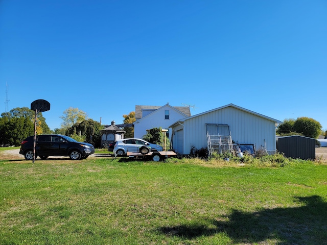 view of side of home featuring a garage and a lawn