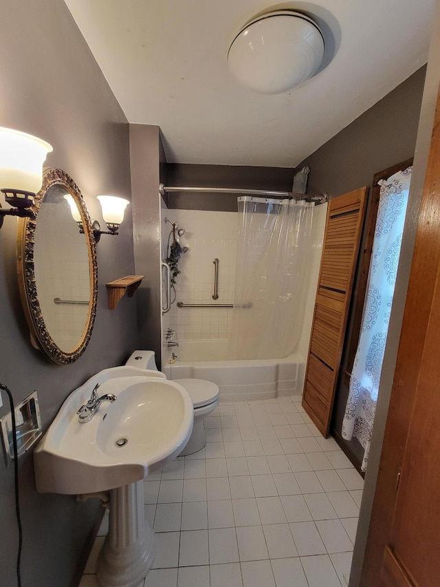 full bathroom with shower / tub combo, sink, tile patterned floors, and toilet