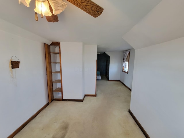 additional living space featuring light colored carpet