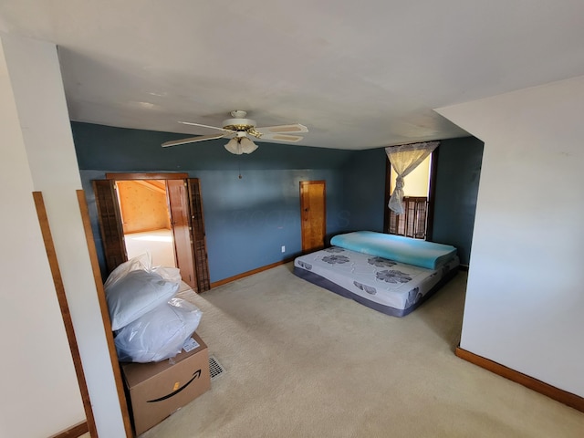 carpeted bedroom with ceiling fan