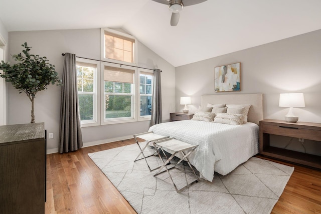 bedroom featuring vaulted ceiling, ceiling fan, and light hardwood / wood-style floors