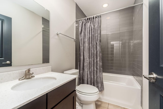 full bathroom with tile patterned flooring, toilet, vanity, and shower / bath combo with shower curtain