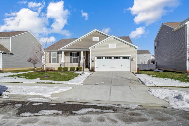 view of front of home featuring a porch and a garage