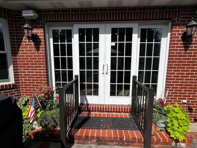 view of exterior entry featuring french doors