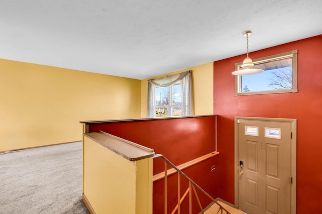 view of carpeted entrance foyer