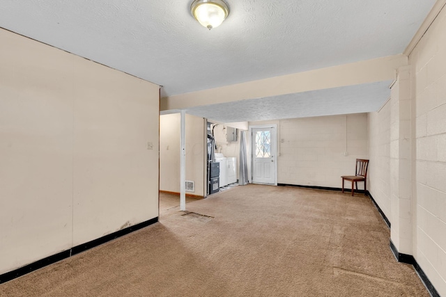 interior space featuring carpet and a textured ceiling