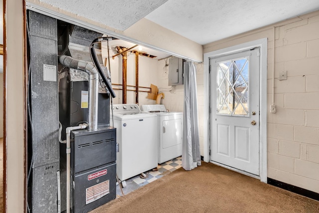 washroom with electric panel, washer and clothes dryer, light carpet, and a textured ceiling